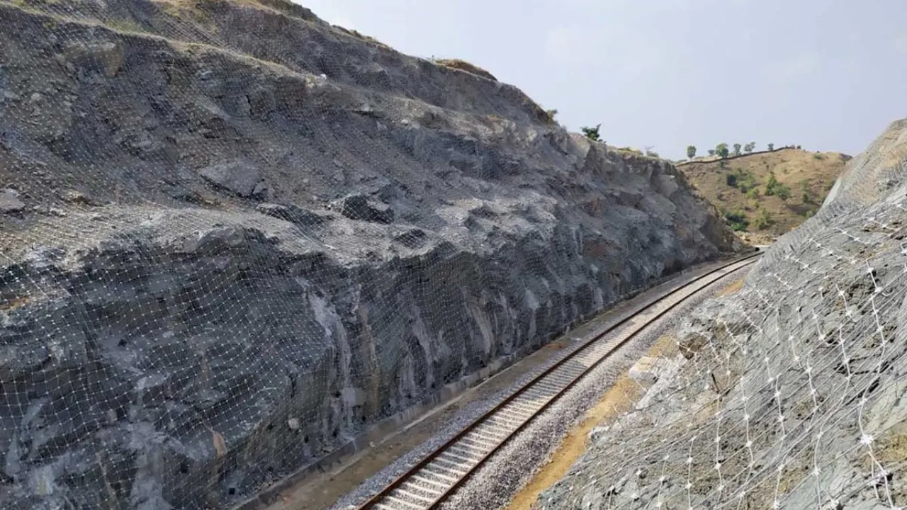 Rockfall protection with double twisted steel wire mesh on railway slope